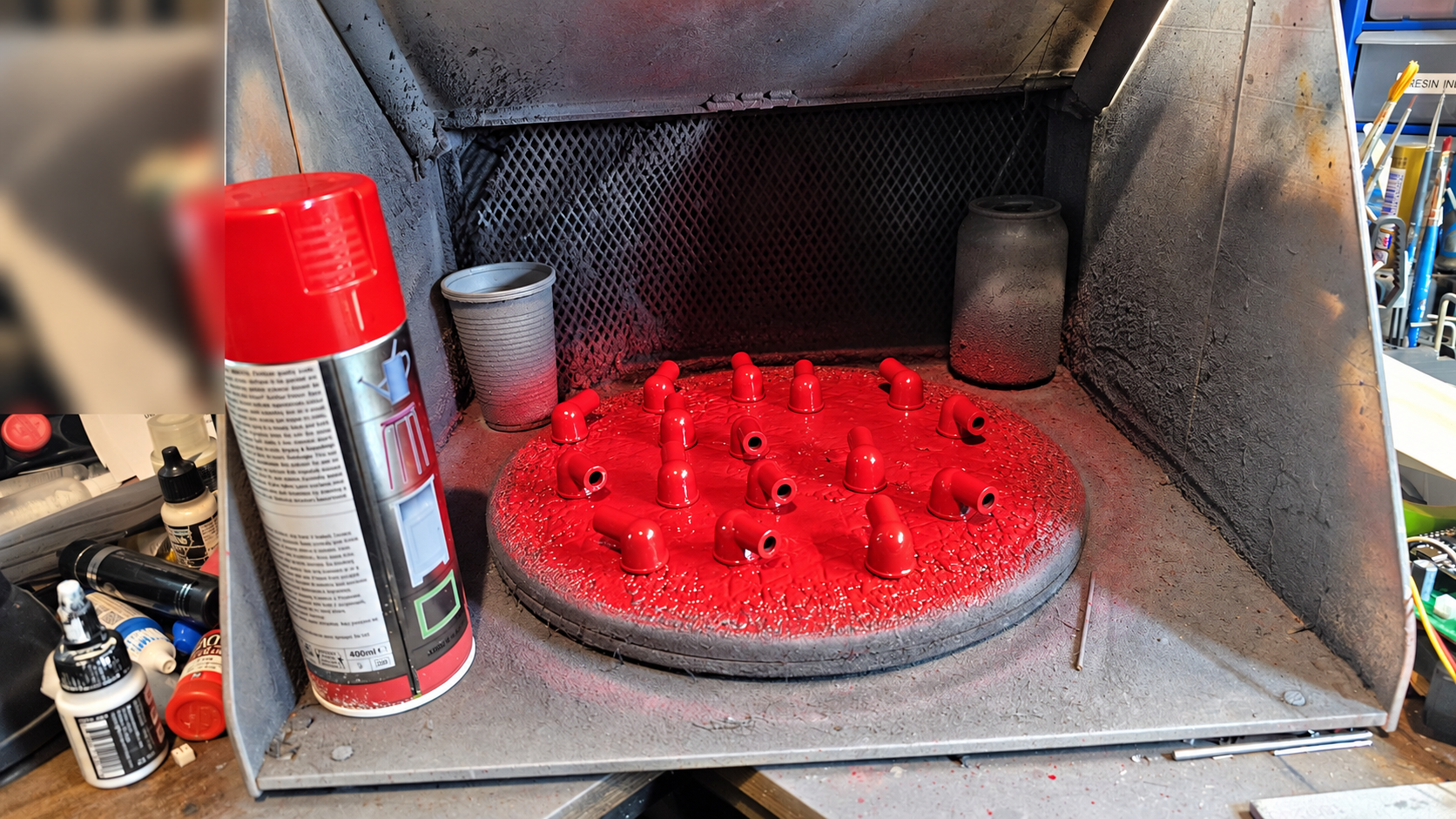 Hand-finishing parts in the spray booth